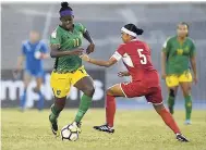  ?? FILE ?? Jamaica’s Khadija Shaw (left) in action against Cuba during the final round of the Caribbean Zone qualifiers at the National Stadium.