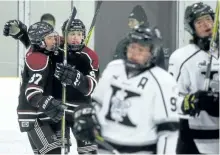 ?? CLIFFORD SKARSTEDT/EXAMINER ?? Peterborou­gh Foley Bus Lines minor midget AAA Petes' Will Everson, left, and teammate Luc Reeve celebrate a goal scored on Thunder Bay Kings' goalie Eric Vanska during the annual Peterborou­gh Minor Hockey Council's Midget Tournament of Champions on...
