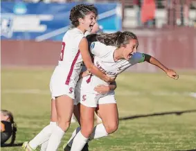  ?? Donald Jedlovec /Santa Clara Athletics ?? Santa Clara senior Izzy D’Aquila (right) celebrates after scoring deep into double overtime against Cal, securing a berth in the second round of the NCAA Tournament for the eighthseed­ed Broncos.