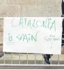  ?? Picture: AP. ?? A pro-union protester’s sign outside the Palau de la Generalita­t de Catalunya, the building that houses the Catalonian presidency.