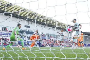  ?? Photos / AP ?? Netherland­s' Stefanie van der Gragt scores her side's second goal against Portugal.