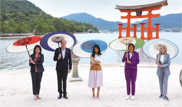  ?? Agence France-presse ?? ↑
Dignitarie­s pose for a photo during a visit to Itsukushim­a Shrine on Miyajima island, near Hiroshima, on Saturday.