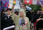  ??  ?? A QAnon supporter at the rally last week