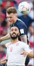  ?? ?? Australia’s Harry Souttar, rear, heads the ball during the World Cup Group D soccer match between Tunisia and Australia at the Al Janoub Stadium in Al Wakrah, Qatar, Nov. 26, 2022. Australia edged Tunisia 1-0. (AP)