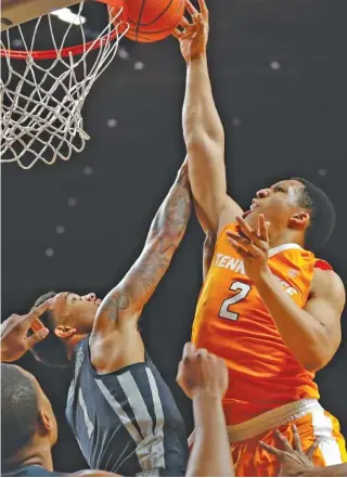  ?? THE ASSOCIATED PRESS ?? Tennessee forward Grant Williams shoots over Iowa State guard Nick Weiler-Babb during the first half of the visiting Vols’ 68-45 victory Saturday in Ames, Iowa.