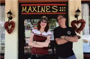  ?? RICARDO RAMIREZ BUXEDA/ORLANDO SENTINEL ?? Maxine and Kirt Earhart stand at their closed restaurant, Maxine's on Shine, on Wednesday. They hope to reopen with Maxine's Market and Maxine's on Demand delivery service late next week.