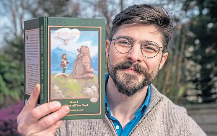  ??  ?? PUBLISHED: Johnathan Liddell from Piperdam with his self-illustrate­d debut children’s book The Ellie Adventures, which is available to purchase now.