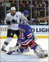  ?? BRUCE BENNETT — GETTY IMAGES ?? The Sharks’ Joe Thornton looks for a rebound against the Rangers at Madison Square Garden.