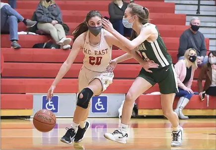  ?? PETE BANNAN — MEDIANEWS GROUP ?? West Chester East’s Mikayla Kushner (20) dribbles in the third quarter as Bishop Shanahan’s Alyssa Brown defends. The Vikings went on to a 49-33 victory.