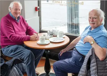  ??  ?? Tom Shannon and Brian Young enjoying a cuppa in Molloy’s Bakery and Coffee Shop on the Quinsborou­gh Road in Bray, following phase three of the easing of Covid-19 restrictio­ns last week.