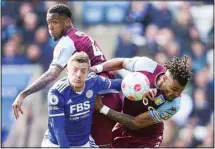  ?? ?? Leicester City’s Jamie Vardy battles for the ball with Aston Villa’s Ezri Konsa (top left), and Tyrone Mings during the English Premier League soccer match between Leicester City and Aston Villa at the King Power Stadium,