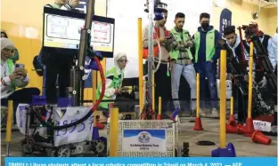  ?? — AFP ?? TRIPOLI: Libyan students attend a local robotics competitio­n in Tripoli on March 4, 2023.