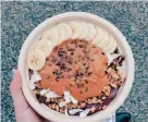  ?? ?? The Acai Bowl (blended acai/ guarana, banana and almond milk topped with fresh banana, peanut butter, granola, coconut, cacao nibs) is on the menu at The Juicery.