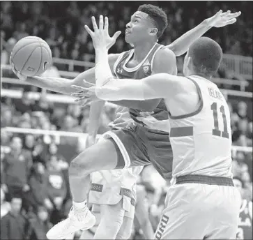  ?? Tony Avelar Associated Press ?? UCLA GUARD Jaylen Hands, who scored 29 points, drives to the basket against Stanford’s Jaiden Delaire.