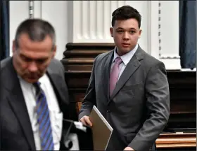  ?? (AP/The Kenosha News/Sean Krajacic) ?? Kyle Rittenhous­e walks into court Monday for the start of jury selection on the first day of his trial in Kenosha, Wis.