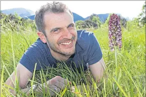  ??  ?? Intrepid orchid-spotter Jon Dunn with the endangered flower