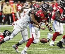  ?? ROBERT ANDRES/ROBERT.ANDRES@AJC.COM ?? Atlanta QB Matt Ryan fumbles as he takes a sack in the first half. Ryan recovered the fumble, but the day took its toll: He was sacked six times and absorbed 12 QB hits.
