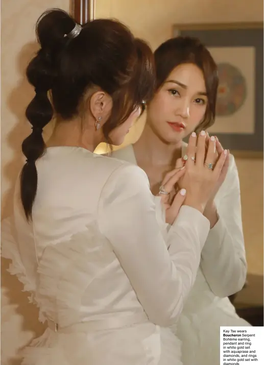  ?? Kay Tse wears Boucheron Serpent Bohème earring, pendant and ring in white gold set with aquaprase and diamonds, and rings in white gold set with diamonds ??