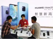  ?? GREG BAKER / AFP / GETTY IMAGES ?? Huawei has quietly establishe­d itself as a provider of technology essential to Canada’s telecom infrastruc­ture.