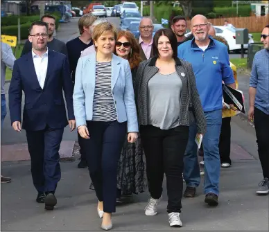  ??  ?? First Minister Nicola Sturgeon on a walk around the area with council leader Susan Aitken as the row escalates