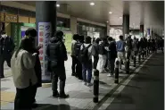  ?? KYODO NEWS VIA AP ?? People make a line to wait for taxi in Sendai, Miyagi prefecture, northern Japan early March 17 following an earthquake.