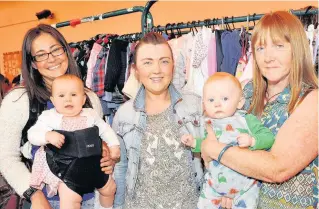  ??  ?? Family affair Laura and Ava Sutherland with little Theo Kerr, being held by gran June Craig, and his mum Roslyn Kerr