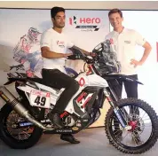  ??  ?? C. S. Santosh ( left) at the unveiling of Team Hero Motorsport­s’ RR 450 bike in New Delhi on Thursday.