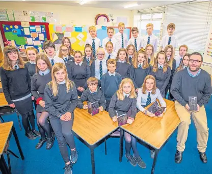  ?? Pictures: Steve MacDougall. ?? The second-year pupils from Perth High School who have written a book of short stories, with all the profits going to WWF, alongside English teacher John Caldwell.