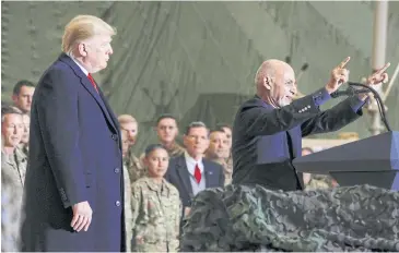  ?? REUTERS ?? President Ashraf Ghani, with President Donald Trump, delivers remarks to US troops in Afghanista­n late last year.