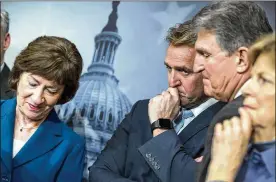  ?? J. SCOTT APPLEWHITE / ASSOCIATED PRESS ?? Sen. Susan Collins (from left), R-Maine, Sen. Jeff Flake, R-Ariz., Sen. Joe Manchin, D-W. Va., and Sen. Jeanne Shaheen, D-N.H., gather for a news conference on the bipartisan immigratio­n deal they reached at the Capitol in Washington on Thursday. The plan fell apart without support from President Donald Trump.