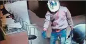  ?? TWITTER ?? ■ CCTV footage grab of the theft at Tiruchirap­alli showroom.