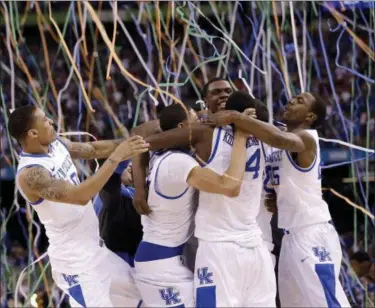  ?? THE ASSOCIATED PRESS FILE ?? Kentucky players celebrate at the end of the 2012 championsh­ip game against Kansas, in New Orleans.