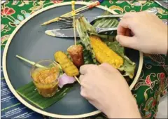  ?? AFP ?? A guest has a meal during the launch of ADM’s Plant-based Innovation Lab in Singapore.