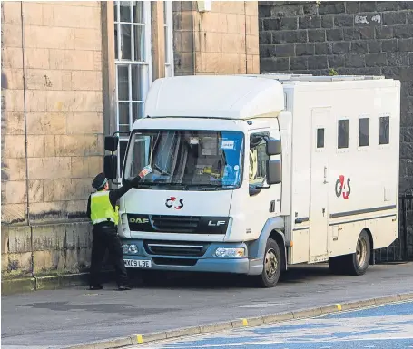  ?? Picture: Steve MacDougall. ?? A G4S vehicle being issued a parking ticket by a traffic warden.