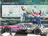  ?? JOHN RAOUX/AP ?? Drivers, from left, Tom Blomqvist, Colin Braun, Helio Castroneve­s and Simon Pagenaud celebrate Sunday after winning the Rolex 24 at Daytona.