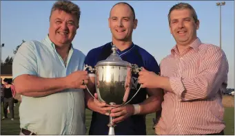  ??  ?? St Mary’s captain Darren Clarke receives the Paddy Sheelan Cup from Seamus Sheelan and Des Halpenny.