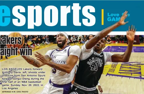  ?? AP/RINGO H▪W▪ CHIU PHOTO ?? LOS ANGELES Lakers forward Anthony Davis, left, shoots under pressure from San Antonio Spurs forward Gorgui Dieng during the first half of an NBA basketball game, Sunday, Nov▪ 20, 2022, in Los Angeles▪