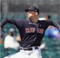  ?? ROSS D. FRANKLIN/AP ?? Cleveland pitcher Sam Hentges, here pitching in a spring training game March 12, struck out three of the four batters he faced on Tuesday.