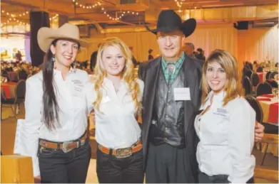  ??  ?? National Western Stock Show president Paul Andrews stands with three scholarshi­p recipients from the National Western Scholarshi­p Trust: Anna Clare Monlezun of Colorado State University, and Bobby Dorsal and Sarah Marvin of the University of Wyoming....