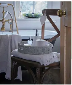  ?? ?? Emmie dining chair, £129; Boho 3 tealight centrepiec­e, £10; ceramic heart hanging dec, £1.50; Dorma soy wax candle, £14; Pretty Boho towels, from £6, all Dunelm