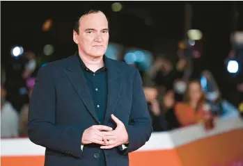  ?? ALBERTO PIZZOLI/GETTY-AFP 2021 ?? Filmmaker Quentin Tarantino has released his first work of nonfiction,“Cinema Speculatio­n.”