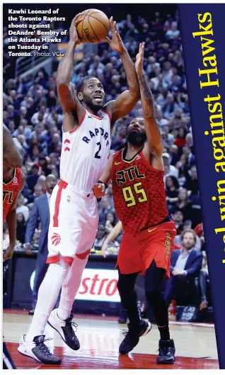  ?? Photo: VCG ?? Kawhi Leonard of the Toronto Raptors shoots against DeAndre’ Bembry of the Atlanta Hawks on Tuesday in Toronto.