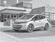  ?? PROVIDED BY GENERAL MOTORS VIA AP] [PHOTO ?? This photo provided by General Motors Co. shows the 2017 Chevrolet Bolt, one of just two EVs with more than 200 miles of range. Unlike the Tesla Model 3, the Bolt is now readily available at dealership­s across the country.