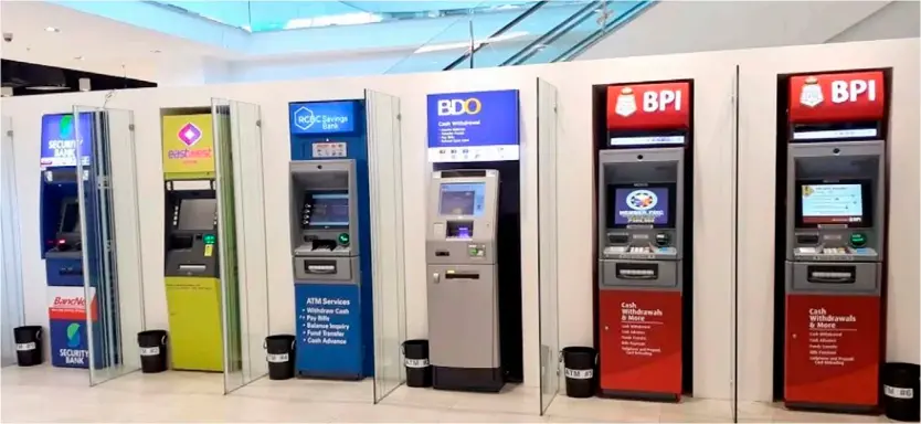  ??  ?? AN ATM cluster belonging to various banks. The BSP reiterated that banks are prohibited from setting their own ATM fees without prior regulatory approval.