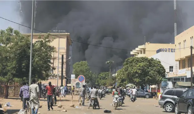  ?? PICTURE: AHMED OUOBA/GETTY IMAGES ?? Black smoke rises as multiple attacks targetted the French embassy, the French cultural centre and Burkina Faso’s military headquarte­rs