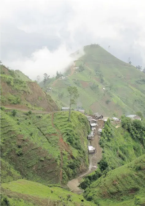  ??  ?? The breathtaki­ng mountain ranges and terraced hillsides of Haiti’s Massif de la Selle offer stunning views and well-worn trails for hiking.