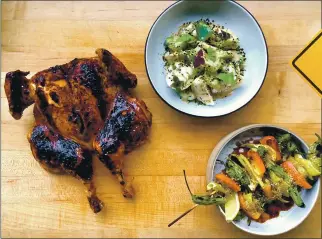  ?? ANNIE RAINERO ?? Ernest’s Brandon Rice brought Walnut Creek his whole roasted chicken glazed in tare with summer pepper shish kebab and cucumber salad.