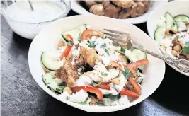  ?? GRETCHEN MCKAY Pittsburgh Post-Gazette/TNS ?? With some advance prep, this easy chopped chicken shawarma bowl makes a quick weeknight dinner.