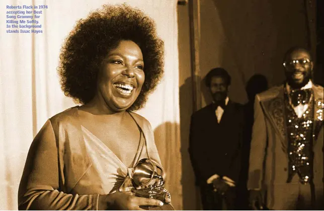  ??  ?? Roberta Flack in 1974 accepting her Best Song Grammy for Killing Me Softly. In the background stands Issac Hayes