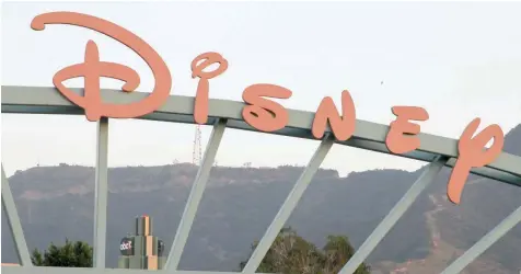  ?? — Reuters ?? A part of the signage at the main gate of The Walt Disney Co is pictured in Burbank, California.